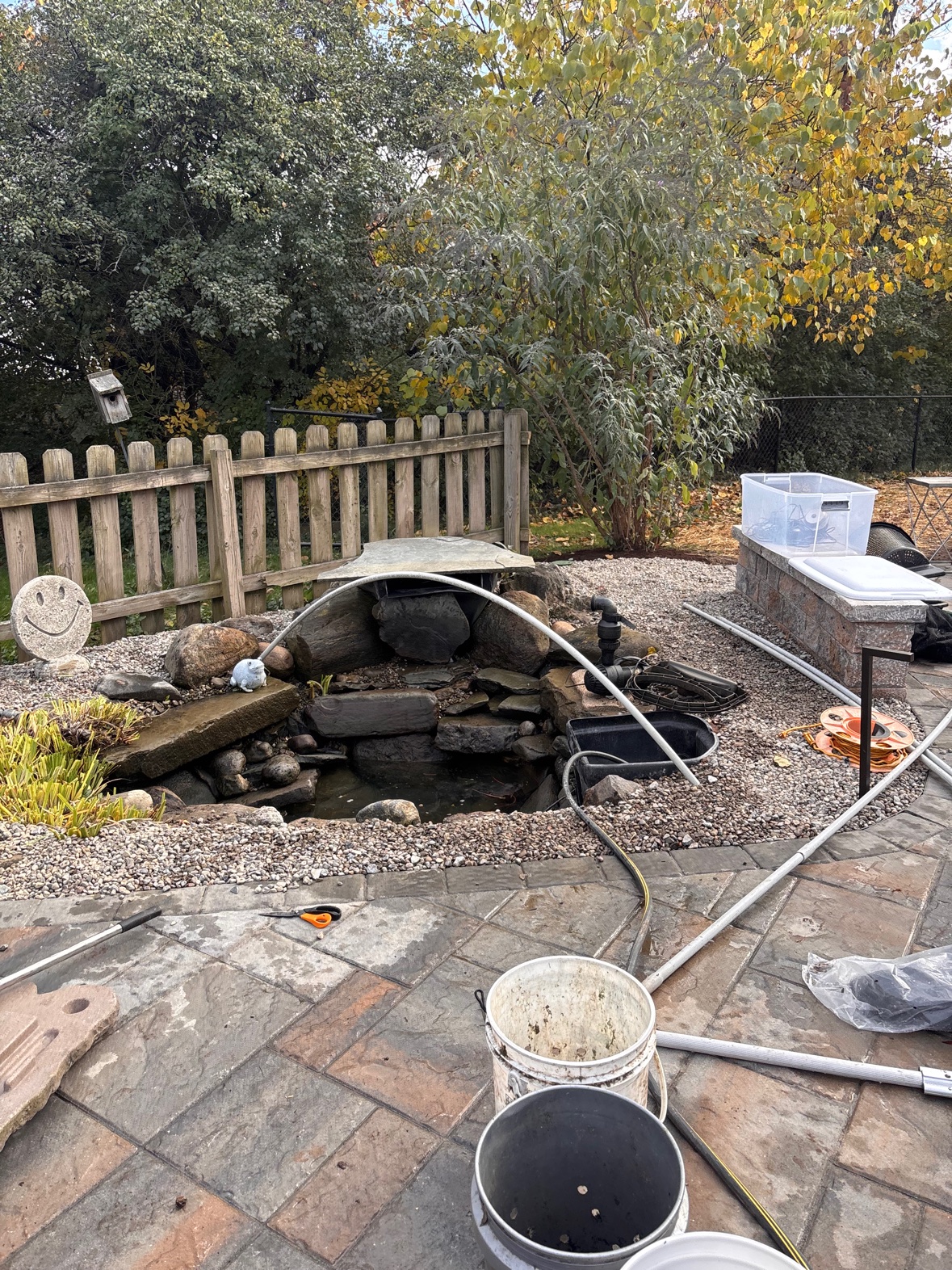 Fall pond closing in progress with the pump pulled for winter storage